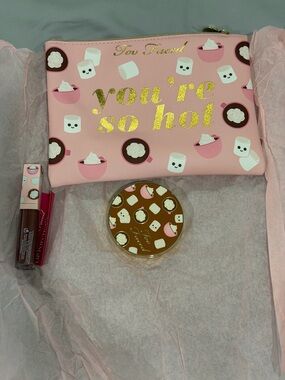 Too Faced pink zip cosmetic pouch with gold foil text